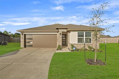 Contemporary elevation with a mix of brick and stucco exterior and welcoming entryway