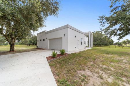 2-car garage with long driveway