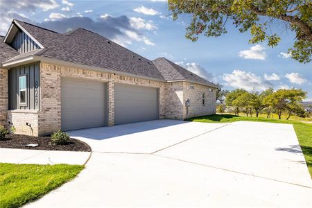 View of property exterior with a garage