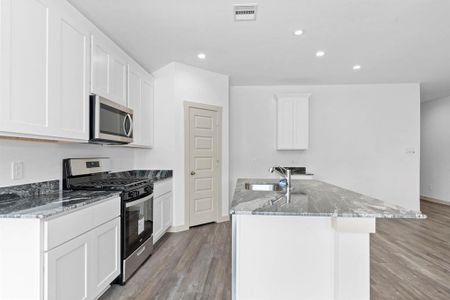 Wonderful Stainless Steel Whirlpool appliances include microwave, dishwasher & gas range! Huge walk-in pantry for all your storage needs! **Image Representative of Plan Only and May Vary as Built**