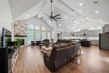 This home has 17 foot ceilings and a wall of windows on the back of the home that frames the wooded nature preserve, that is the back ground for your backyard!