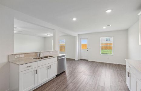 Airy kitchen with oversized island *real home pictured