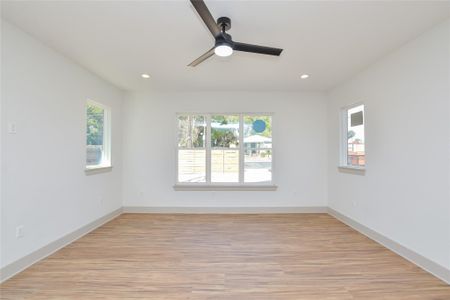 Great room. Luxury vinyl flooring. Recessed can lighting & ceiling fan. Wired for cable & TV electric.