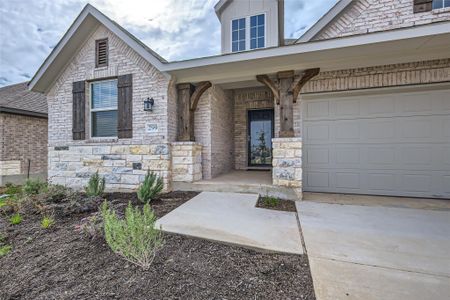 The 2-stall garage and front porch beckon you home!