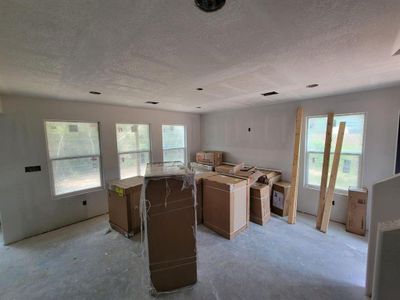 This nice sized family room has lots of windows for natural light.