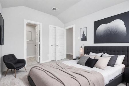 At the forefront, a refined guest suite. Luxurious details like plush carpeting, custom paint, expansive windows with privacy blinds. Sample photo of completed home. Actual color and selections may vary.