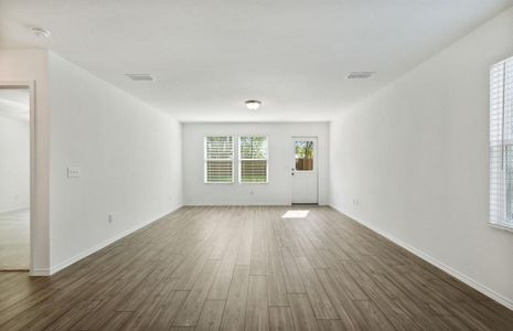 Airy gathering room with large windows *real home pictured