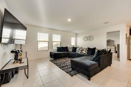 Living room featuring light tile patterned flooring