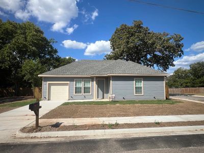 Single story home with a garage