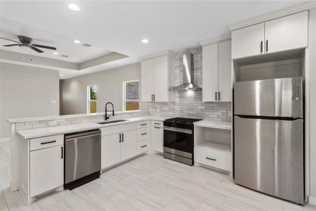 Gorgeous kitchen with quartz countertops and stainless steel appliances