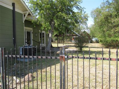 View of gate with a yard