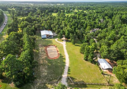 Located on 6.44 acres+ with a pond.