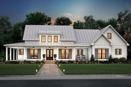 Modern inspired farmhouse with covered porch and a lawn