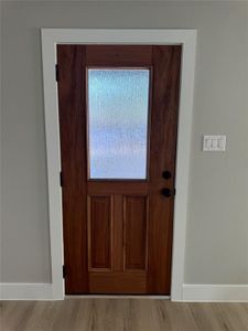 Doorway featuring light hardwood / wood-style floors