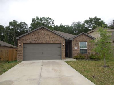 New construction Single-Family house 10470 Sweetwater Creek Drive, Cleveland, TX 77328 - photo 0 0