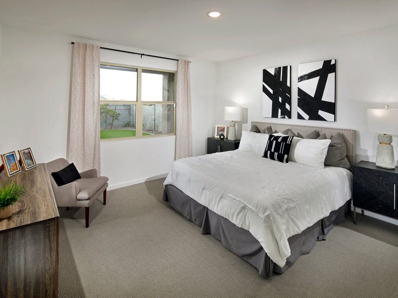 Lark primary bedroom modeled at San Tan Groves