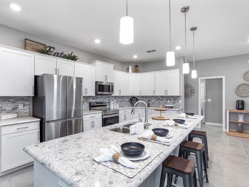 Your new gourmet kitchen includes ample space, a walk-in pantry, and your choice of features and finishes - Waylyn home plan