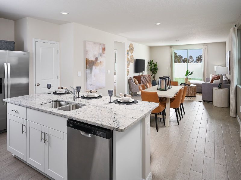 Great Room and Kitchen of the Acadia floorplan modeled at Park East.
