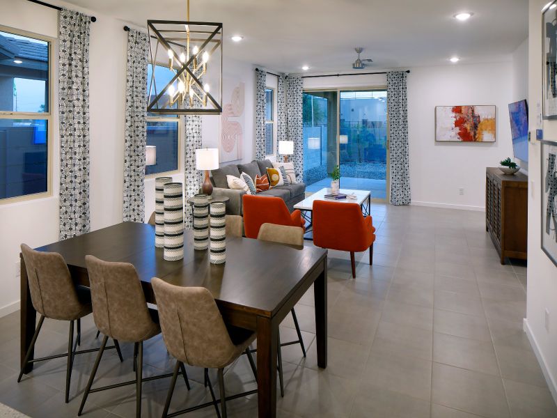The dining area seamlessly connects the kitchen and living area.