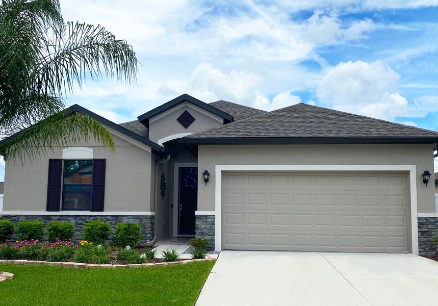 Sweetwater French country exterior with optional stone  new home construction by William Ryan Homes Tampa