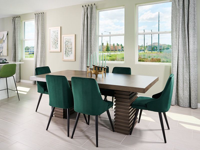Dining room in Acadia floorplan modeled at Lake Deer Estates