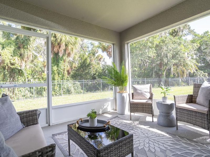 The cafe open to outdoor living on your covered lanai - Raychel model home in Palmetto, FL