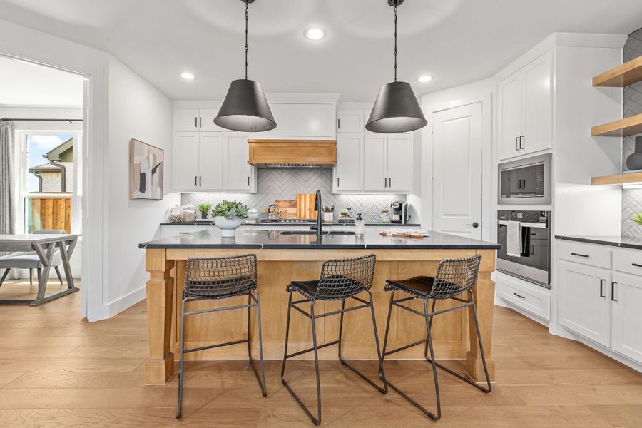 Plan 1406 Kitchen - Mosaic 40s Model - Photo by American Legend Homes