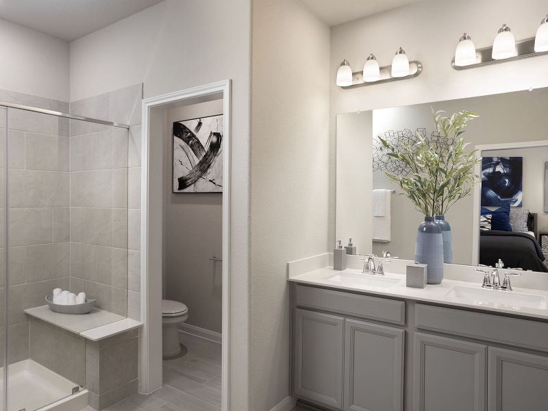 Unwind after a long day in your primary bathroom - modeled at Dunvale Village