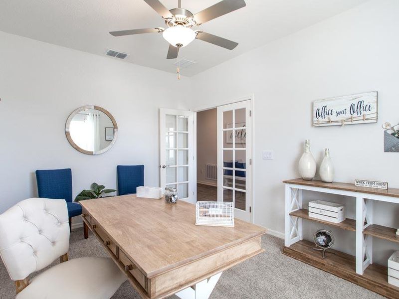 Flexible use rooms, such as this den, can be used as a home office or however suits your needs - Shelby model home in Davenport, FL