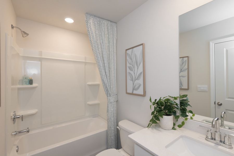 The secondary bathroom is a private retreat for guests.