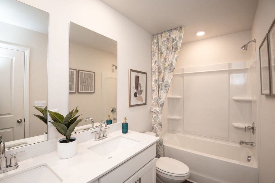 Enjoy a full bathroom with dual vanity sinks.