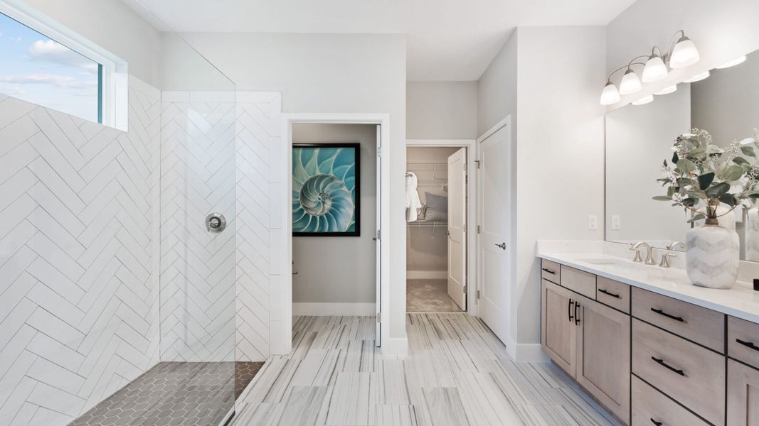 Primary bathrooms accessorized with design upgrades to provide a retreat like feel to your primary suite.
