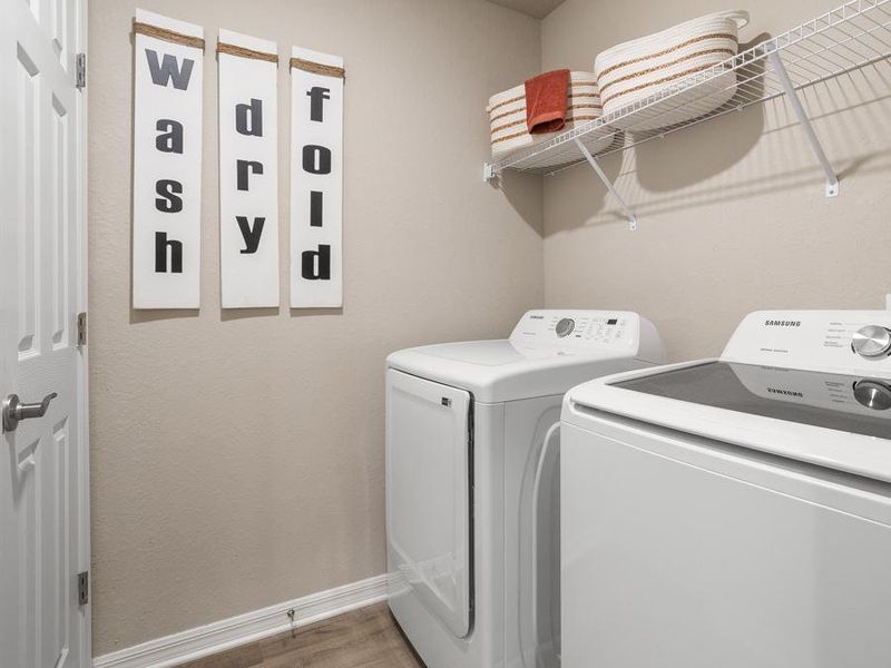 Enjoy built-in conveniences such as this dedicated laundry room - Mariposa townhome model in St. Cloud, FL