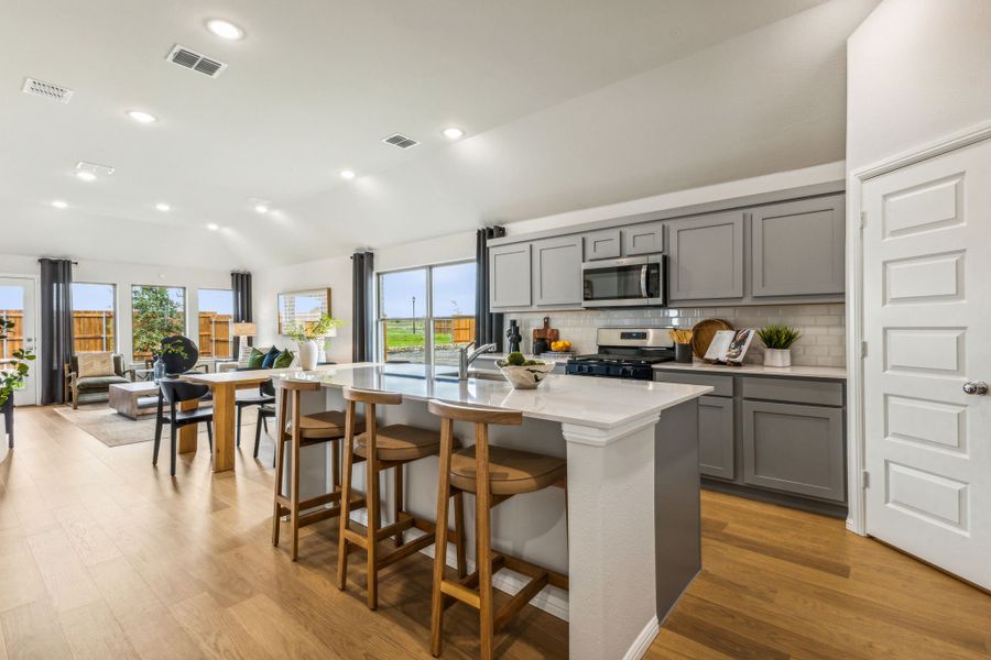 Kitchen in a Stonehaven new Turquoise home in Seagoville TX by Trophy Signature Homes – REPRESENTATIVE PHOTO