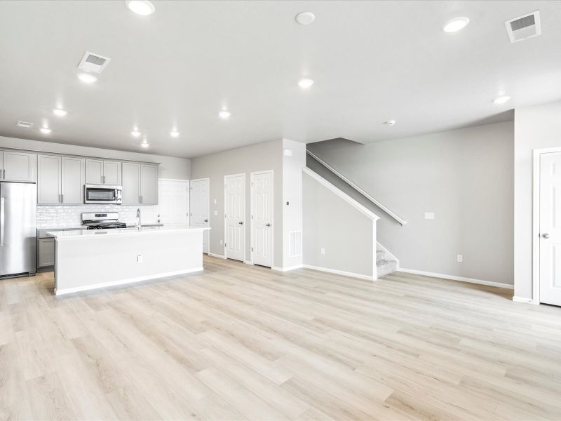 Great room in the Orchard floorplan at a Meritage Homes community in Aurora, CO.