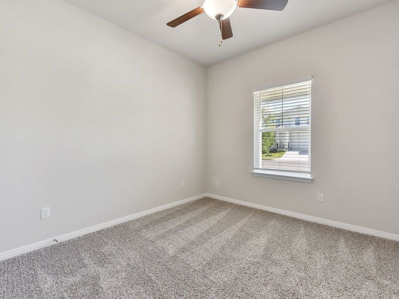 The first floor has one secondary bedroom and one secondary bathroom.