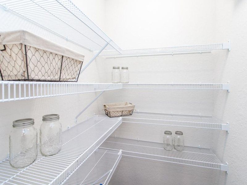 Your new home features built-in storage convenience, such as this walk-in pantry - Parker model home in Haines City, FL