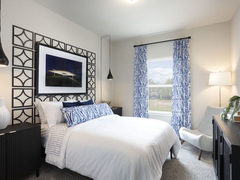Make guests feel at home in  your secondary bedroom - modeled at Dunvale Village