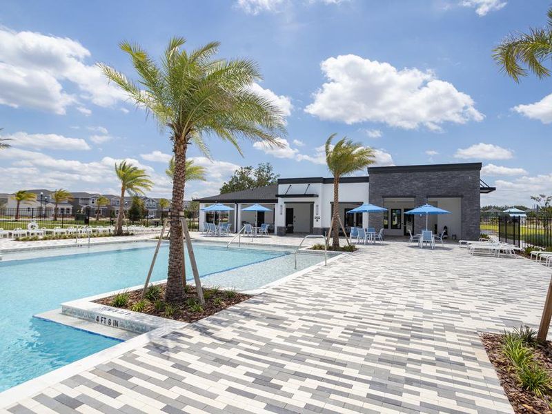 The expansive pool deck is designed for lounging and also has shaded seating.