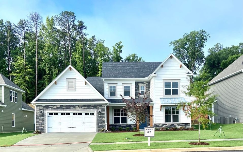 2 story home with a first floor main bedroom