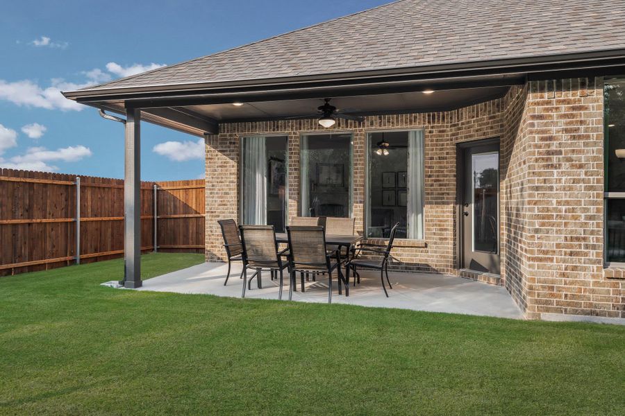 Patio | Concept 2464 at Abe's Landing in Granbury, TX by Landsea Homes