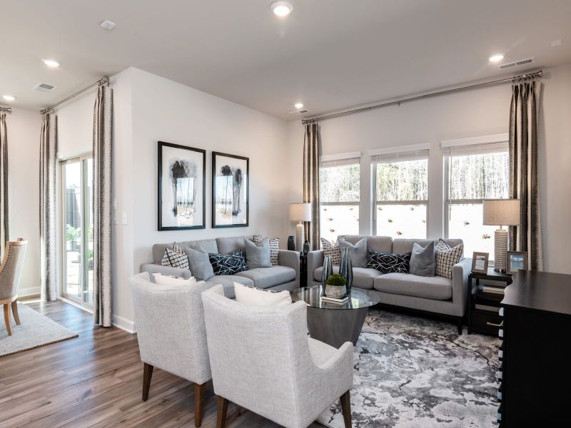 The family room brings plenty of light while offering a cozy space to relax.