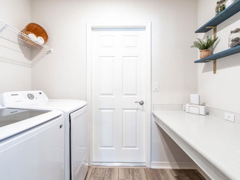 A drop zone at the garage entry helps keep clutter out of your living space - Parker model home in Haines City, FL