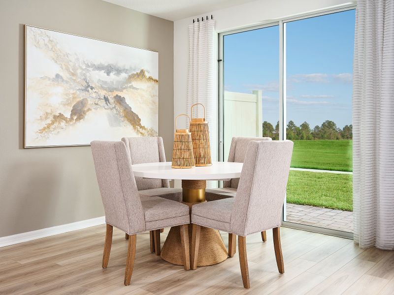 Dining room in the Oakville floorplan modeled at Chase Landing.