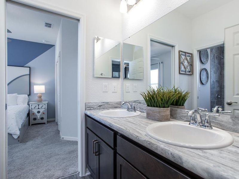 Features such as this Jack-and-Jill bath provide lifestyle convenience - Shelby model home in Davenport, FL