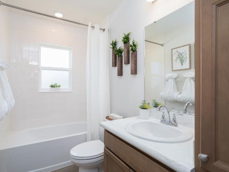A hall bath serves the secondary bedrooms and guests - Peyton model home in Haines City, FL