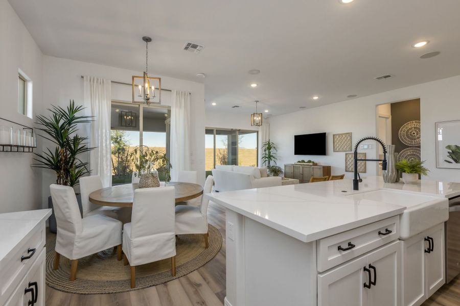 Jimson Floor Plan Kitchen and breakfast nook. Touches of white and green. Great place to eat breakfast lunch and dinner with loved ones new home construction by William Ryan Home Phoenix
