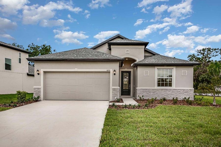 Sanibel new construction home plan with optional stone at Tea Olive Terrace at the Fairways by William Ryan Homes Tampa