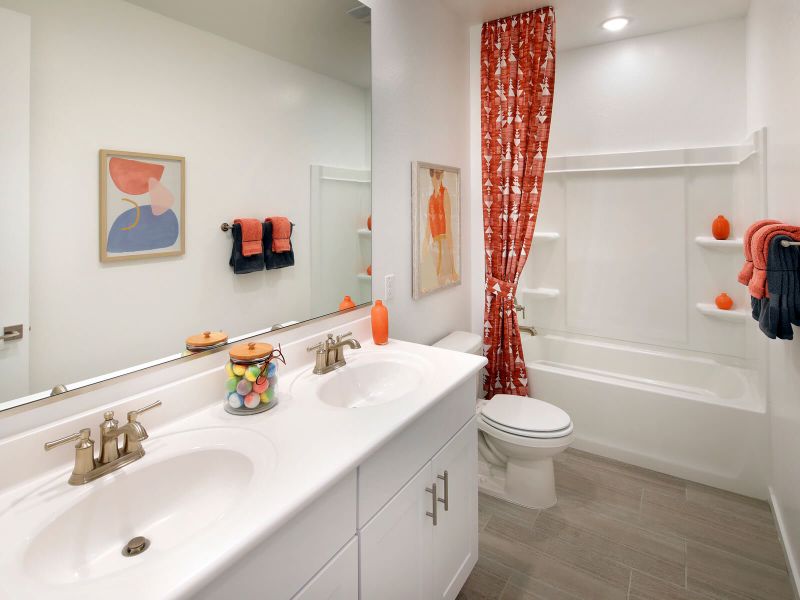 Your family will love the dual sinks and vanity in this spacious bathroom.