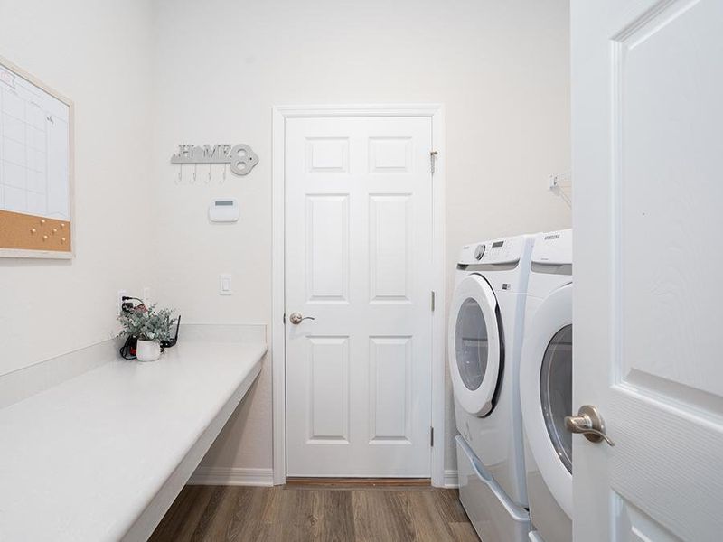 And, a laundry room with drop zone at the garage entry - Shelby model home in St. Cloud, FL